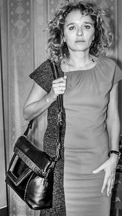Valeria Golino wears Chiara Baschieri dress and leather bag