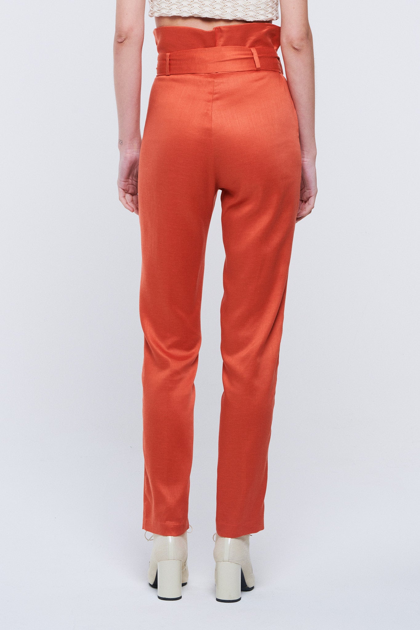 Trousers with orange bow