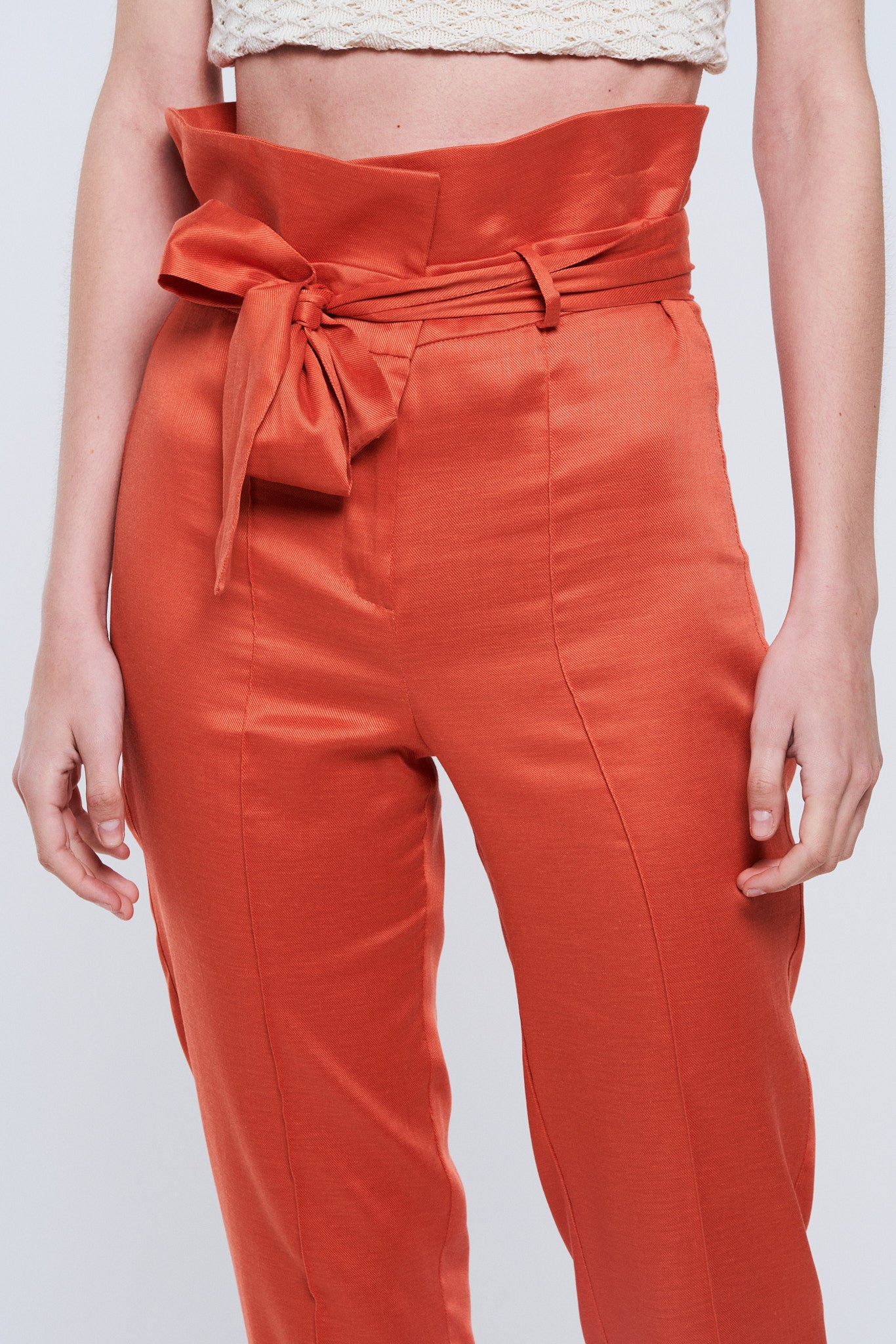Trousers with orange bow